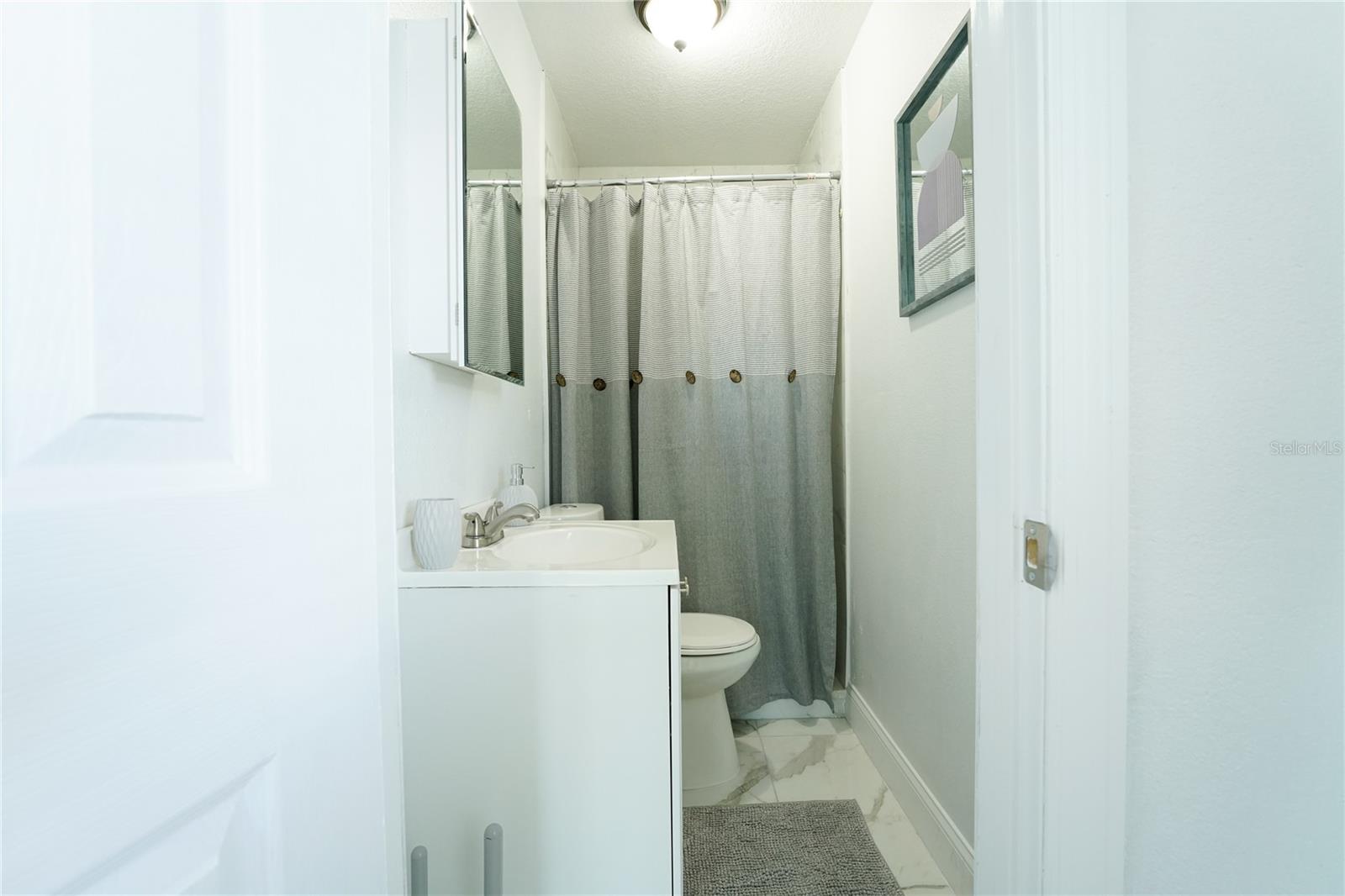 Private ensuite bathroom attached to the primary bedroom, offering convenience, comfort, and added privacy for homeowners or guests.