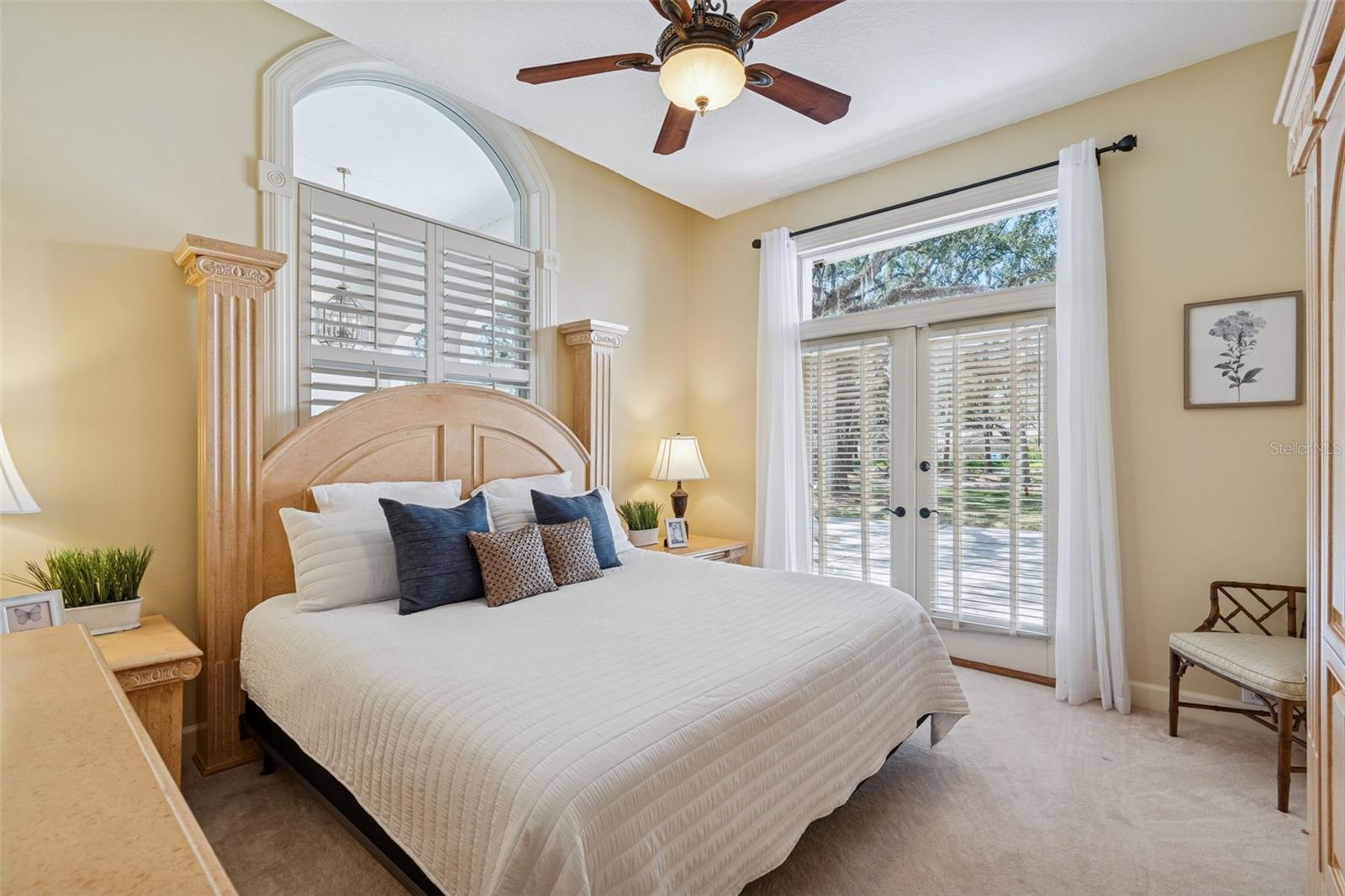The Guest Bedroom Off the Hallway Has French Doors Leading Outside