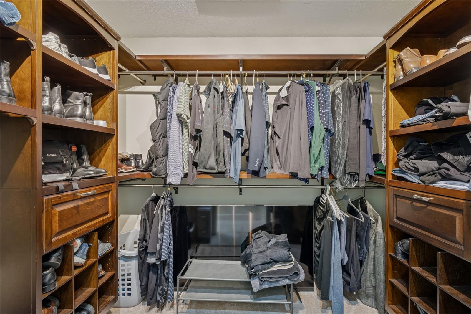 There are Two Walk-In Custom Closets