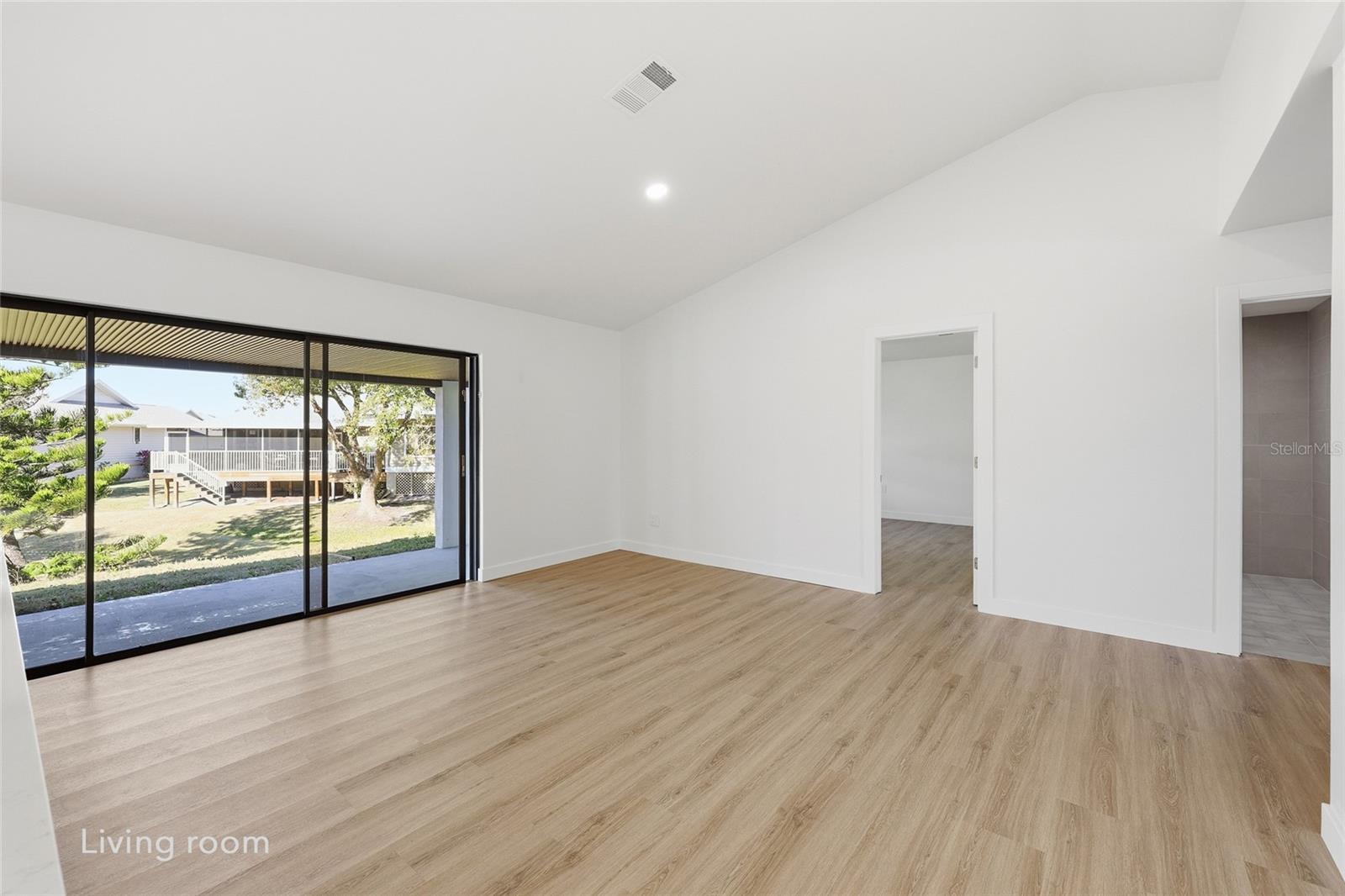 Living room positioned directly across from the kitchen