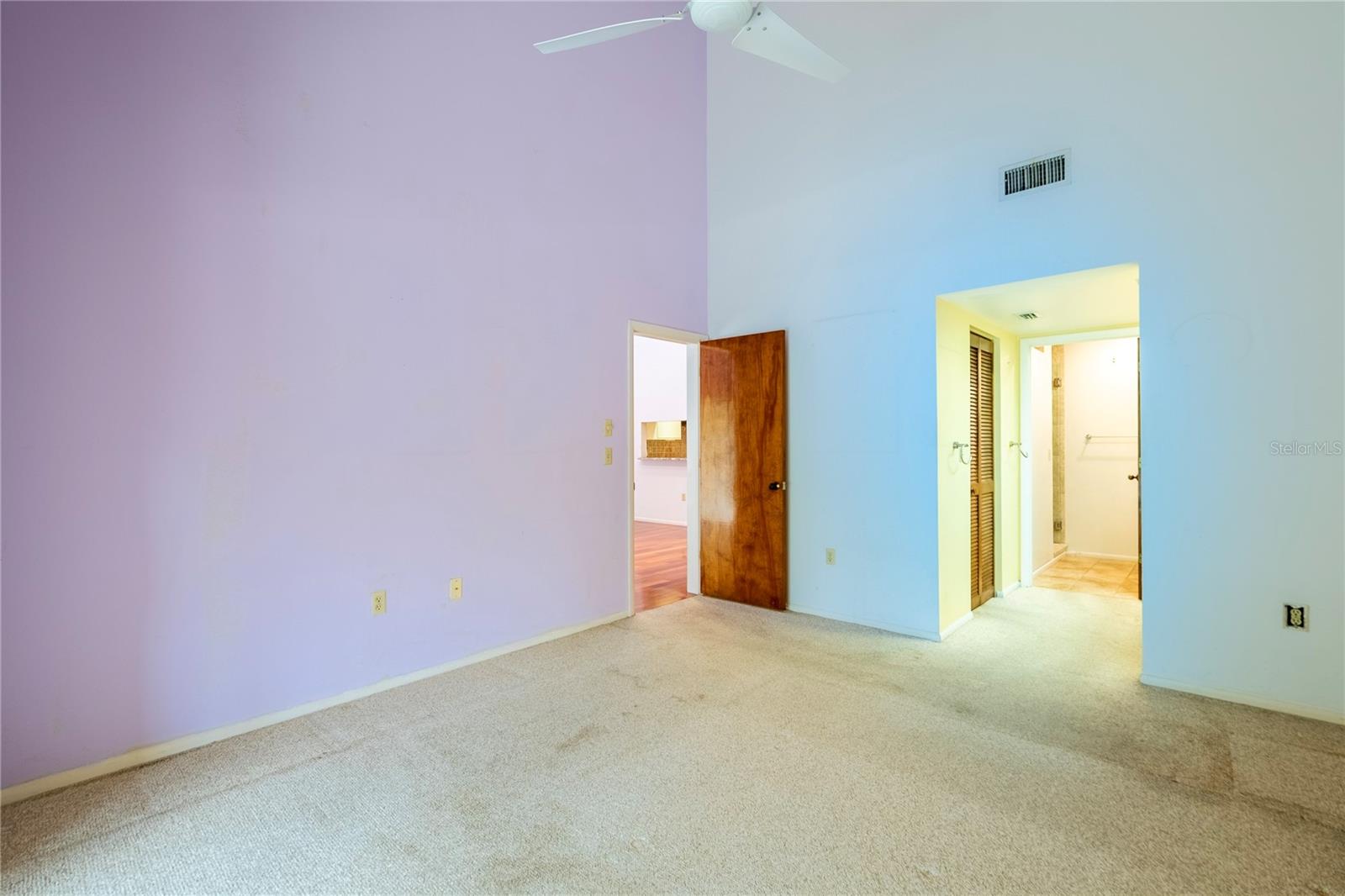 Primary bedroom showing walk in closet entry