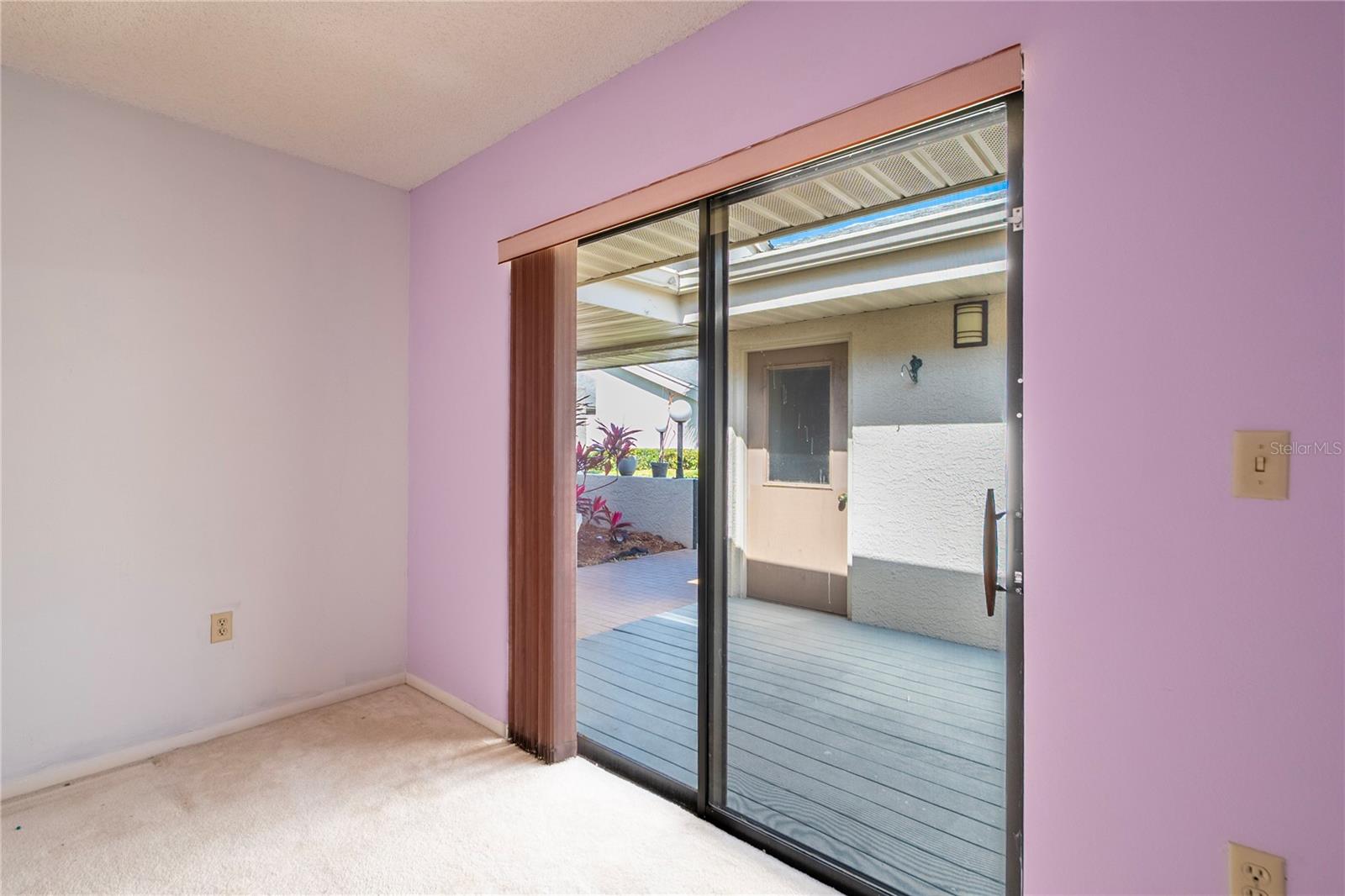 Guest bedroom overlooking front patio