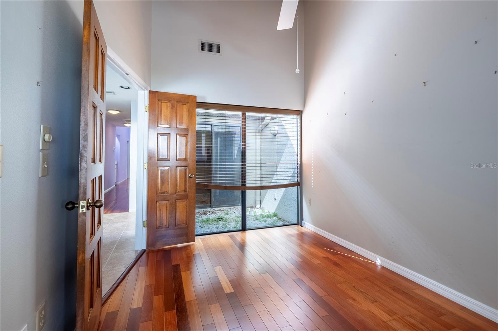 Front wall of flex room toward atrium which always affords additional light to both entry hall, flex room and kitchen