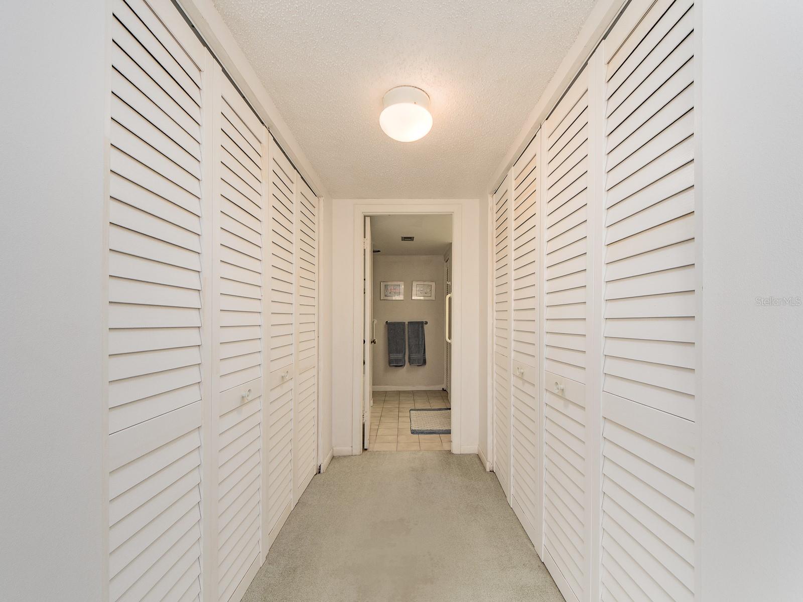 Master dual Closet leading to Primary Bathroom from Bedroom.