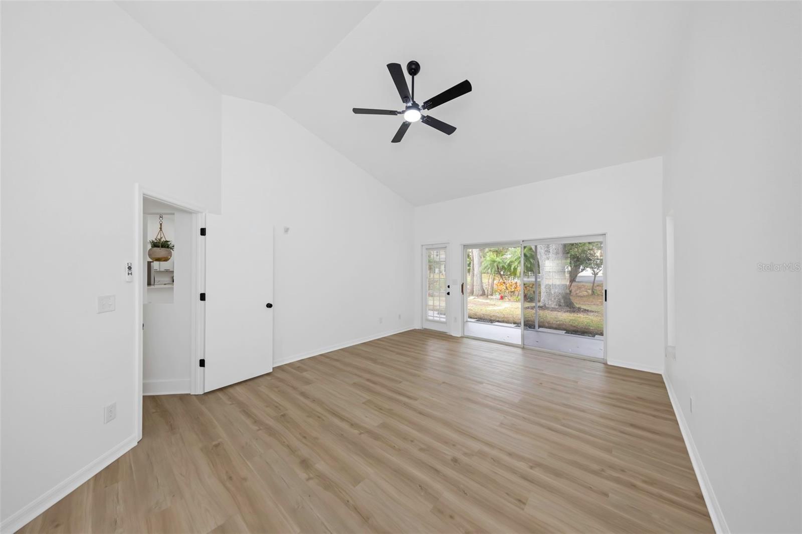 Primary bedroom has access to screened in porch