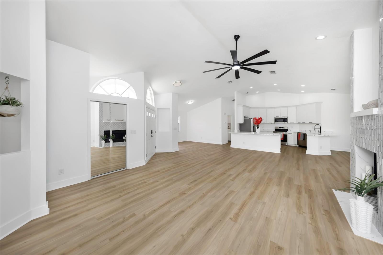 Vaulted ceilings in the living room, dining room and kitchen