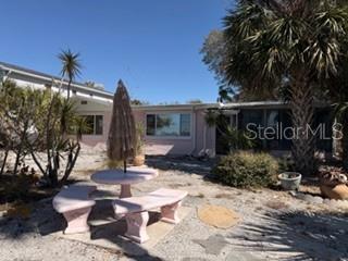 Back yard with concrete table/benches