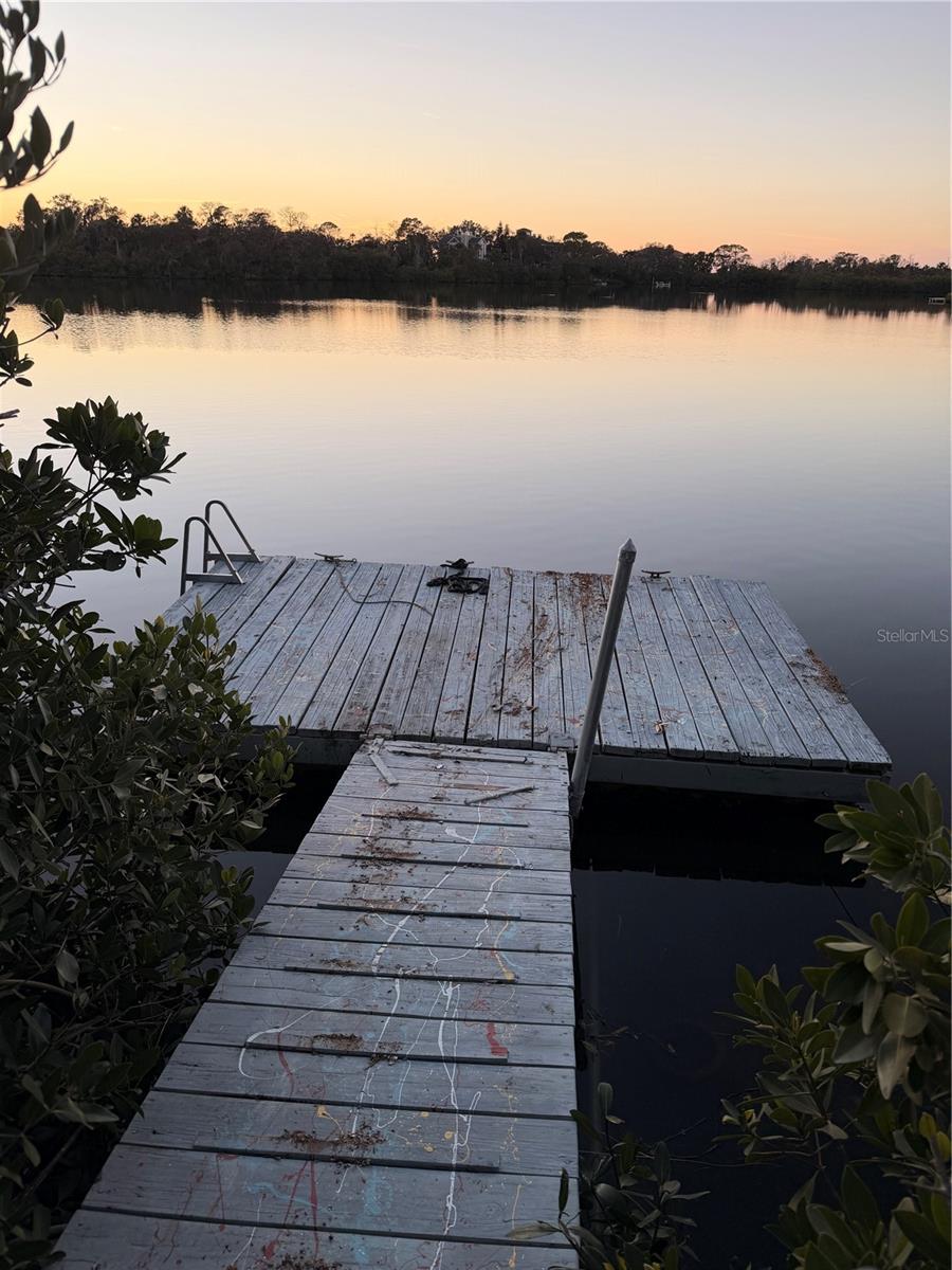 Floating dock for water kayaks, jet ski, skiff, or relaxing.