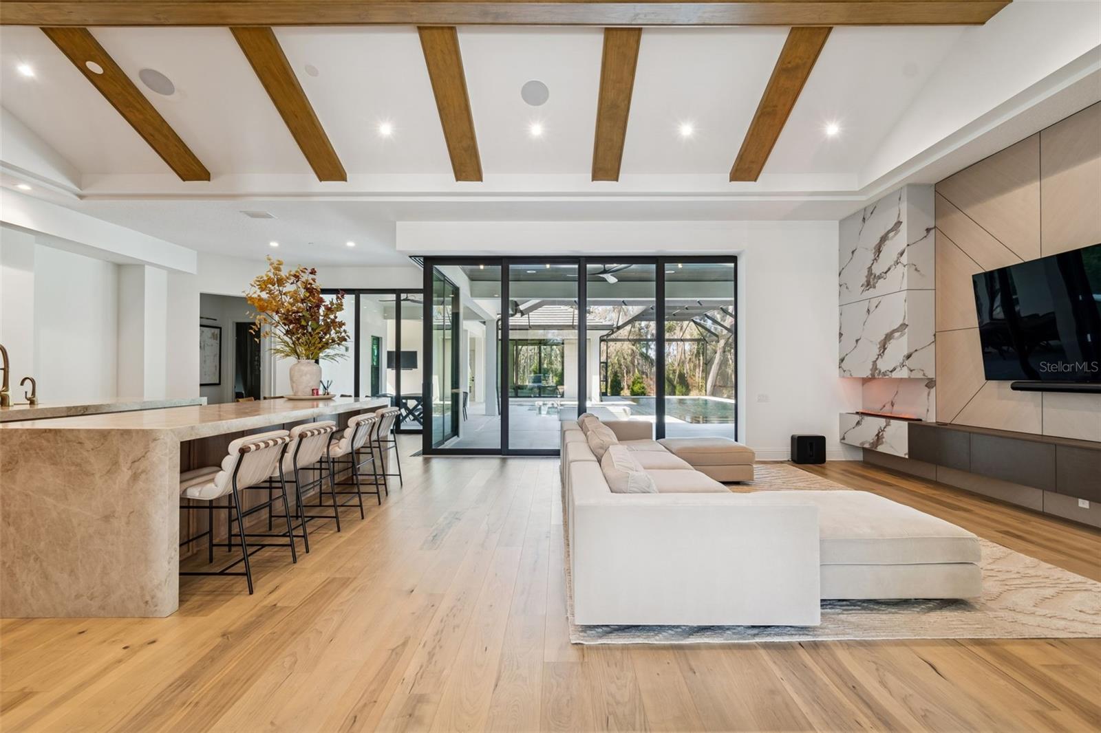 Living room/kitchen overlooking the pool