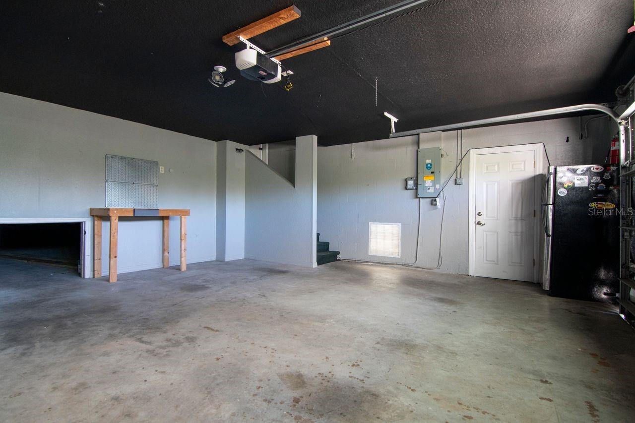 huge garage with bonus storage room underneath.