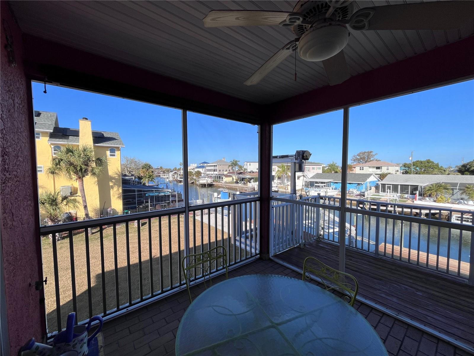 Screened in patio w/ water views
