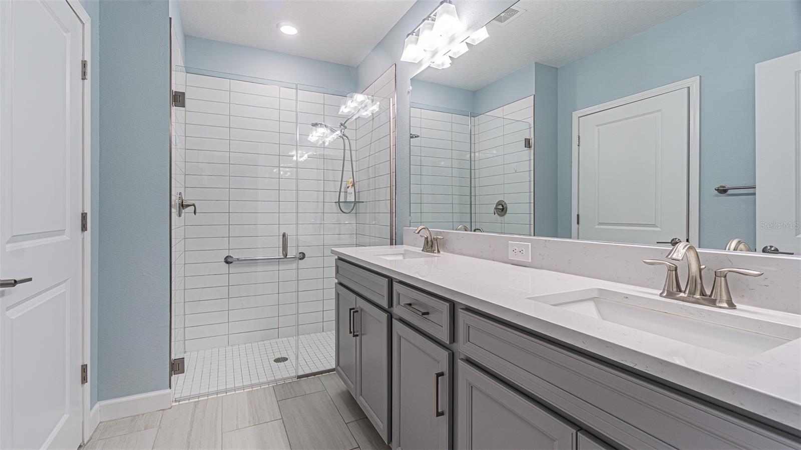 Bath ensuite with large shower and water closet