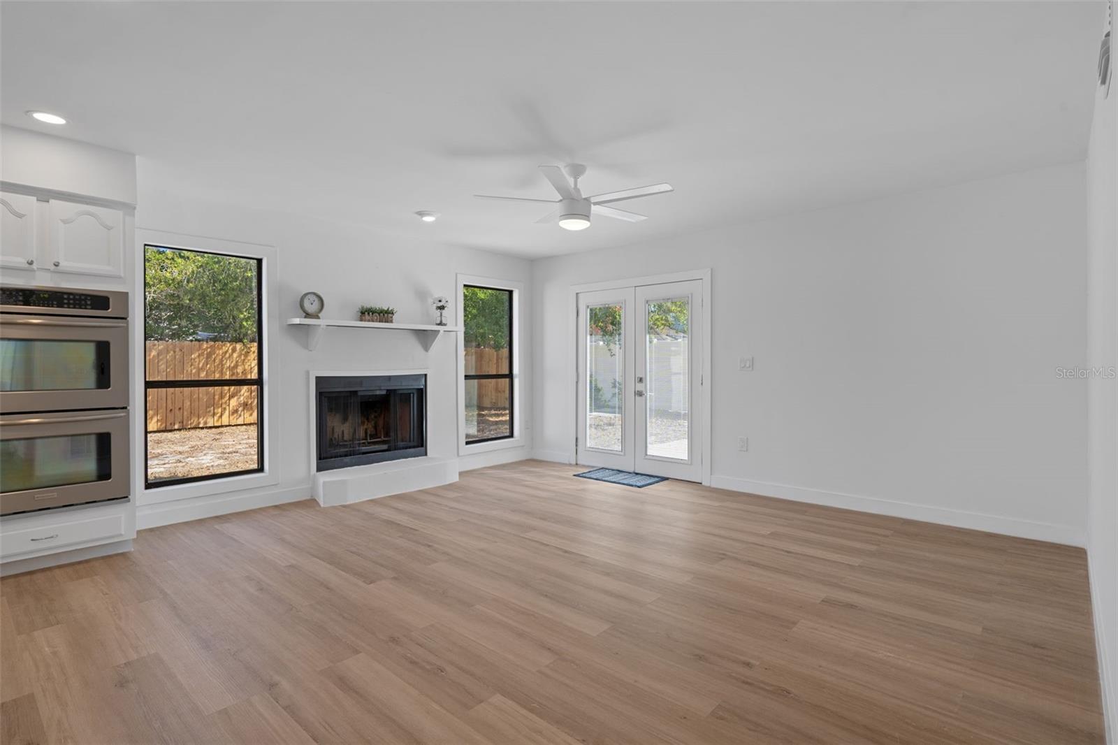 The living room has a beautiful wood burning fireplace