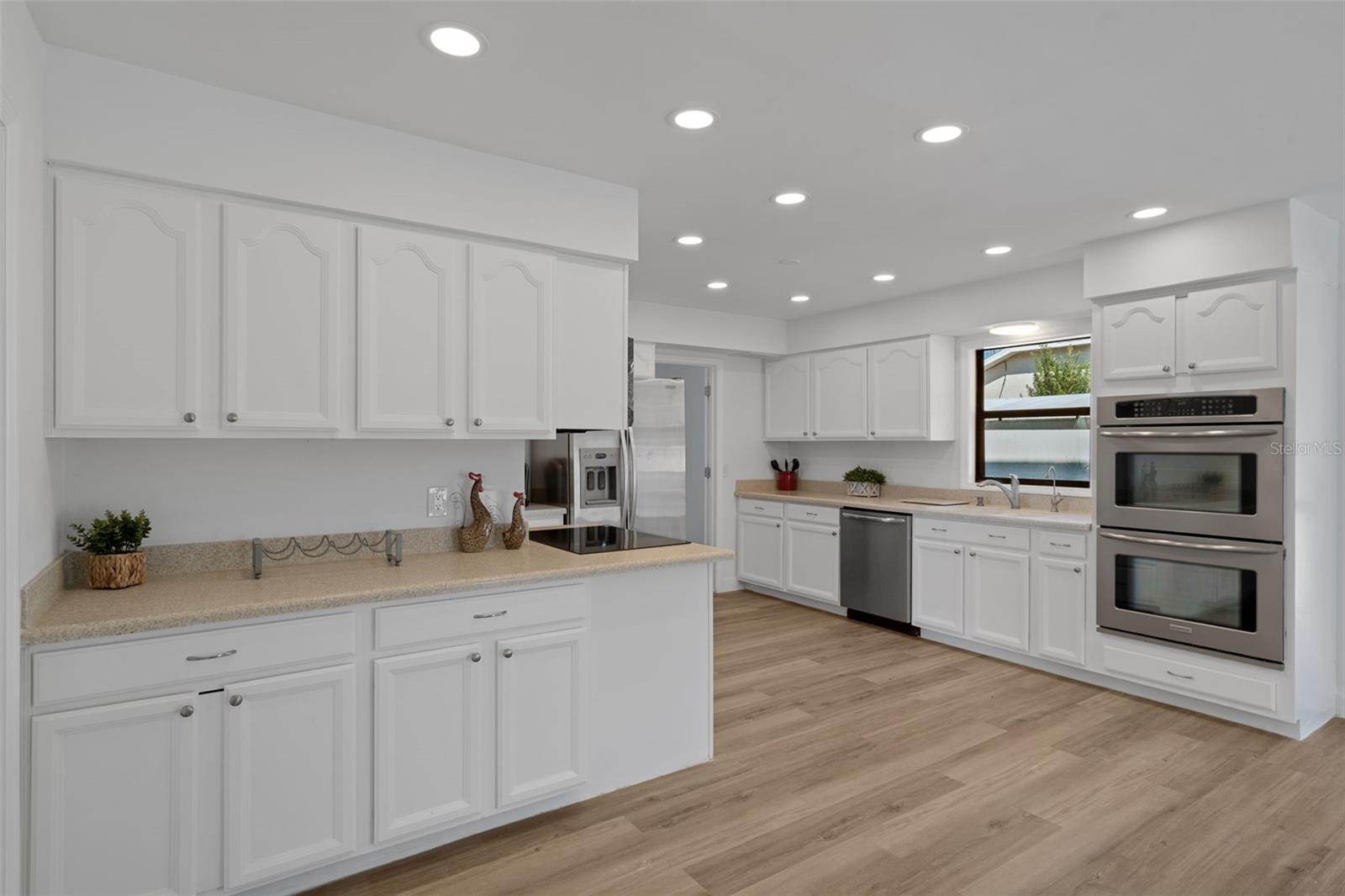 There is an abundance of cabinets and counter top space