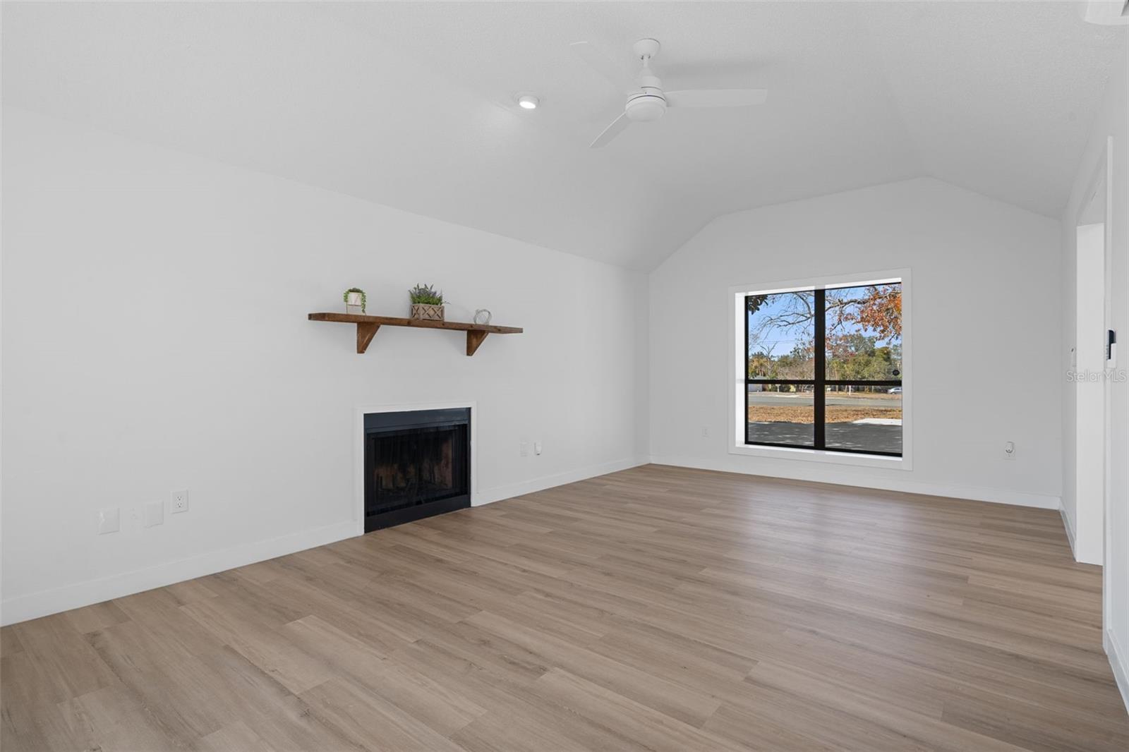 Notice the wood burning fireplace in the Family Room