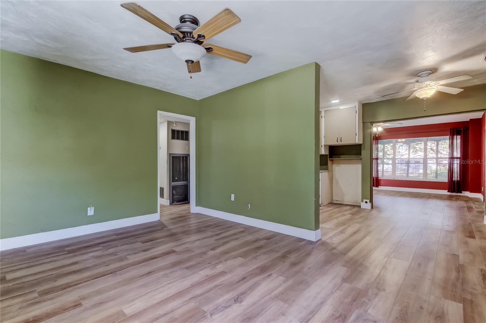 View from Living Room - Hallway to the Left - Kitchen/Dining and Family Room to the Right
