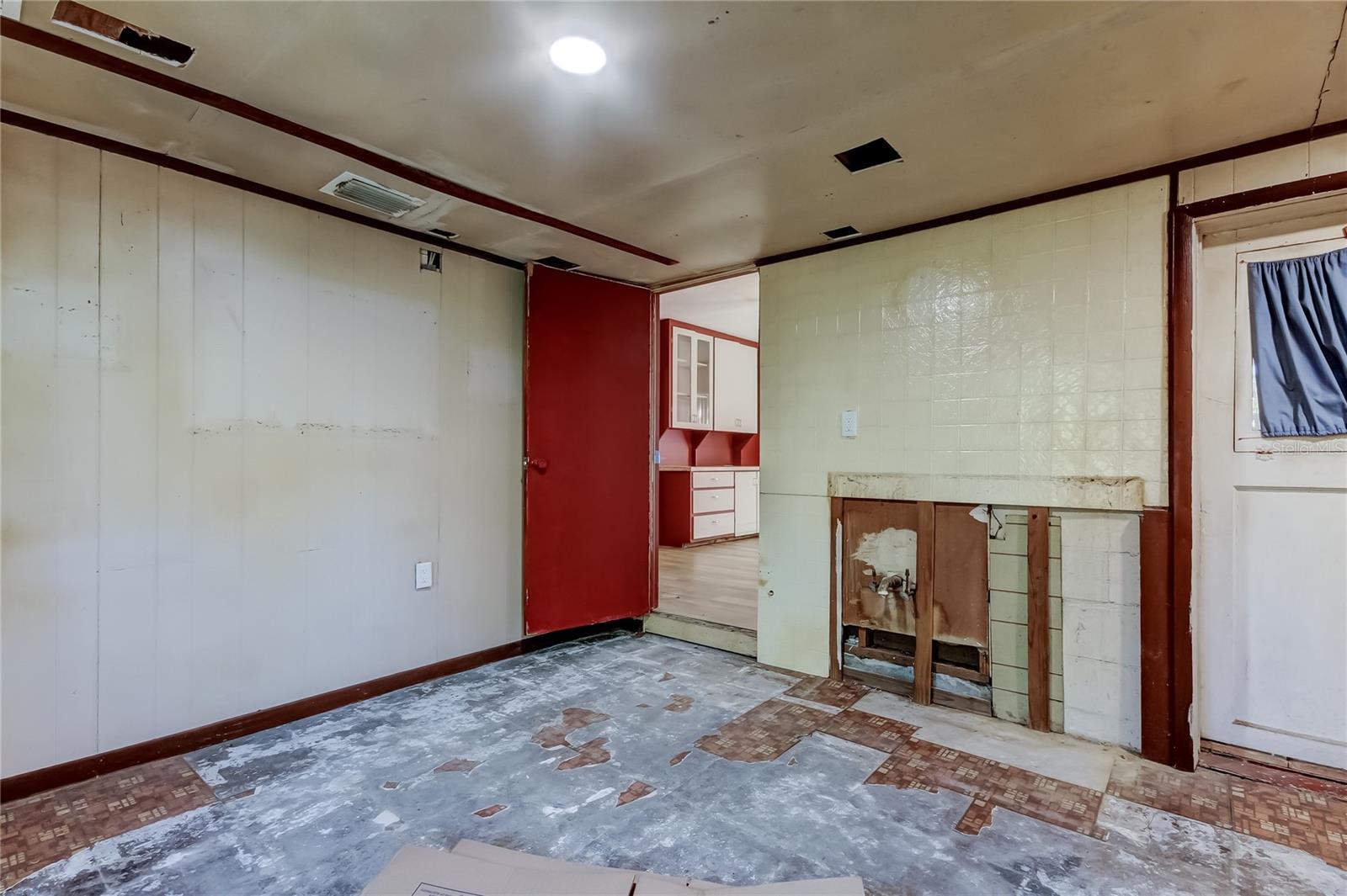 Bonus Room off of the Family Room - There is also an entrance from the Porch - it appears at one time there was a small kitchen with a sink - this is one of three rooms in the Bonus Area