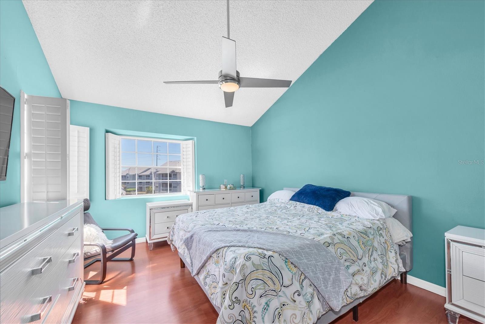 Primary bedroom with vaulted ceilings
