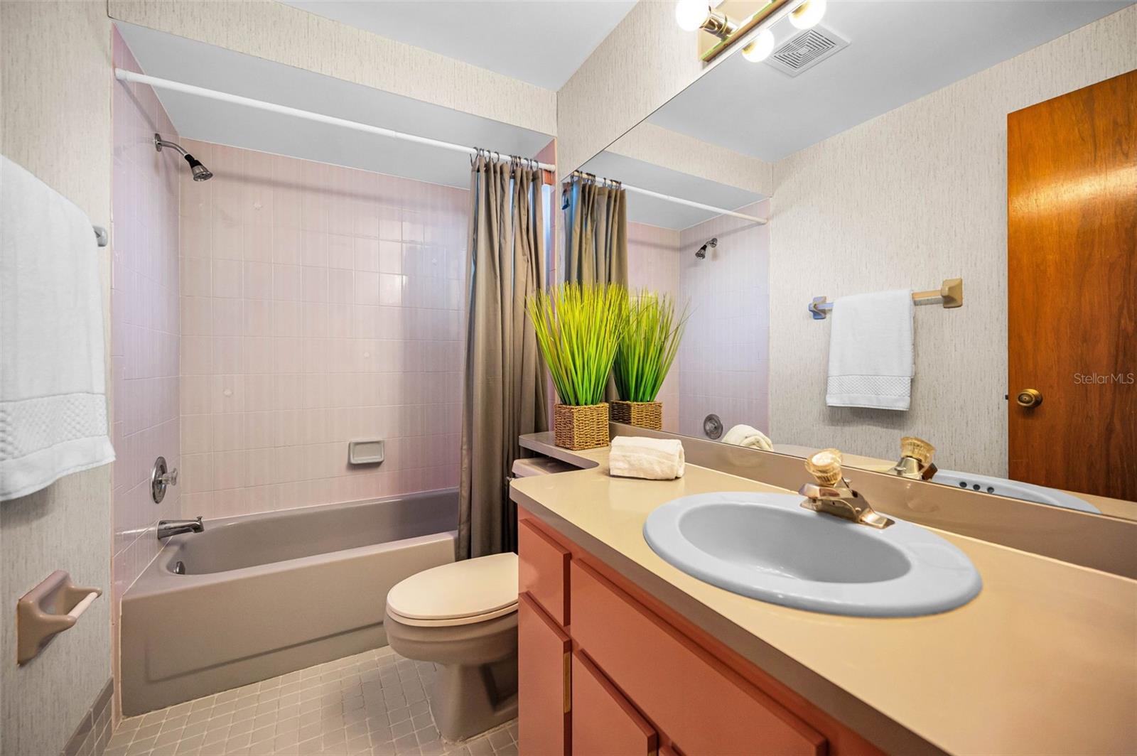 Large second bathroom just down the hall from the second bedroom.