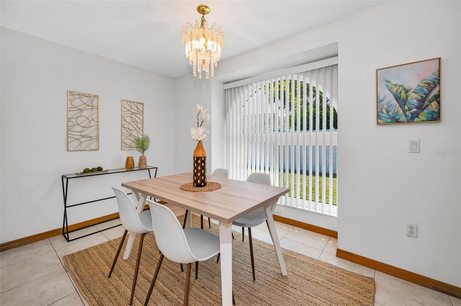 Dining Room with a gorgeous arched window with a view of the backyard!