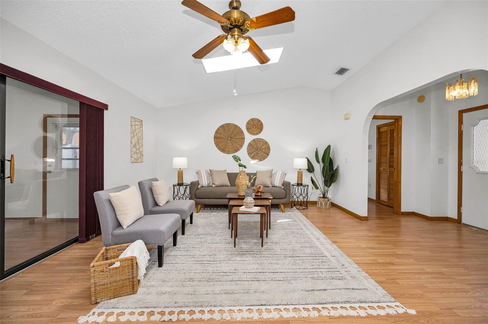 View from Kitchen to Living Room. Sliding doors to the left open to the Florida Room