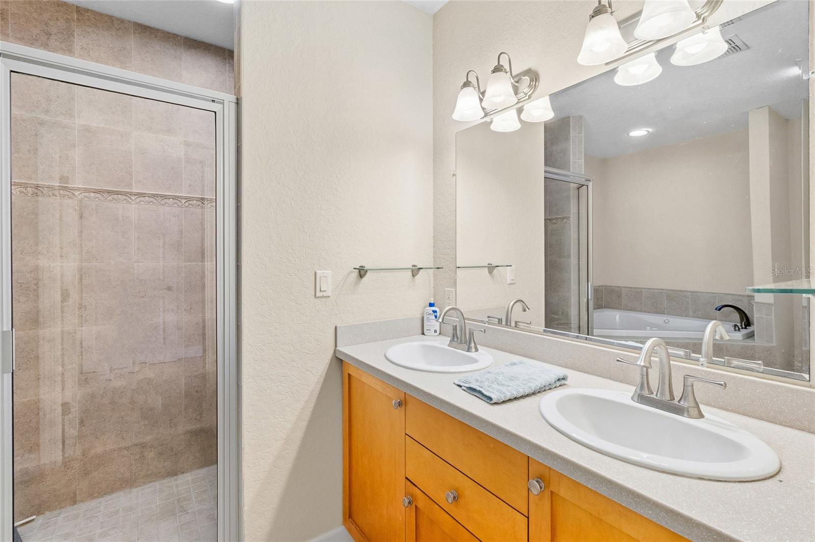 Primary Bathroom with Double Sinks and Walk in Shower