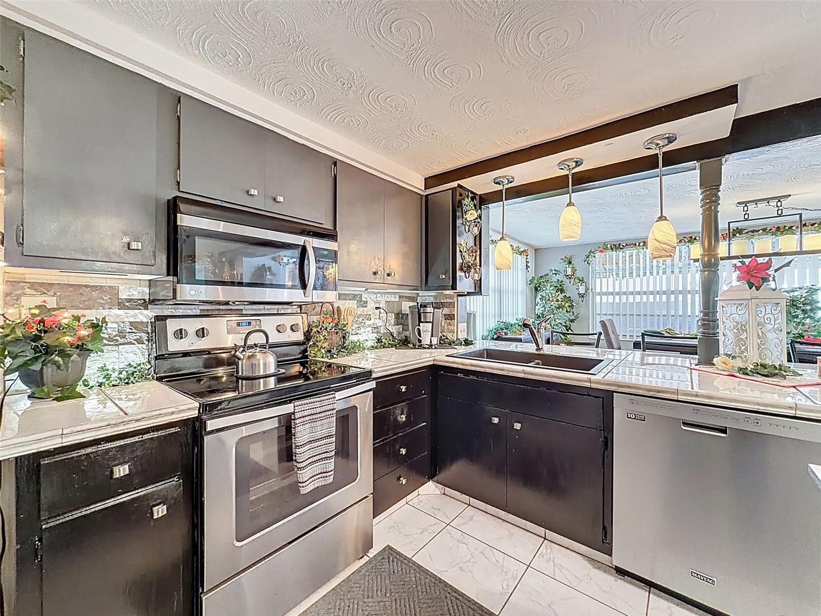 Bright kitchen opens to Dining area