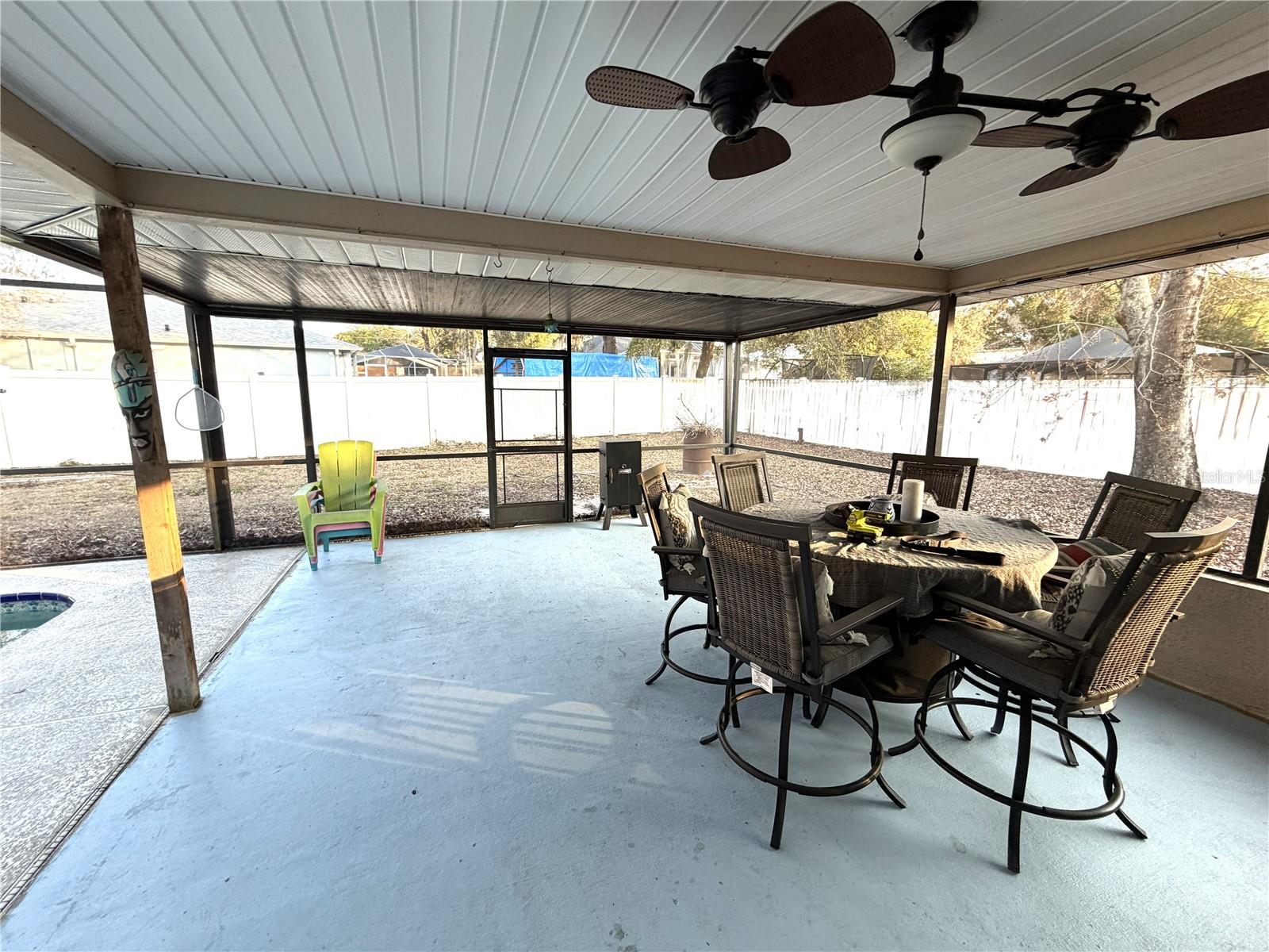 Covered Screen enclosed pation overlooking birdcage pool