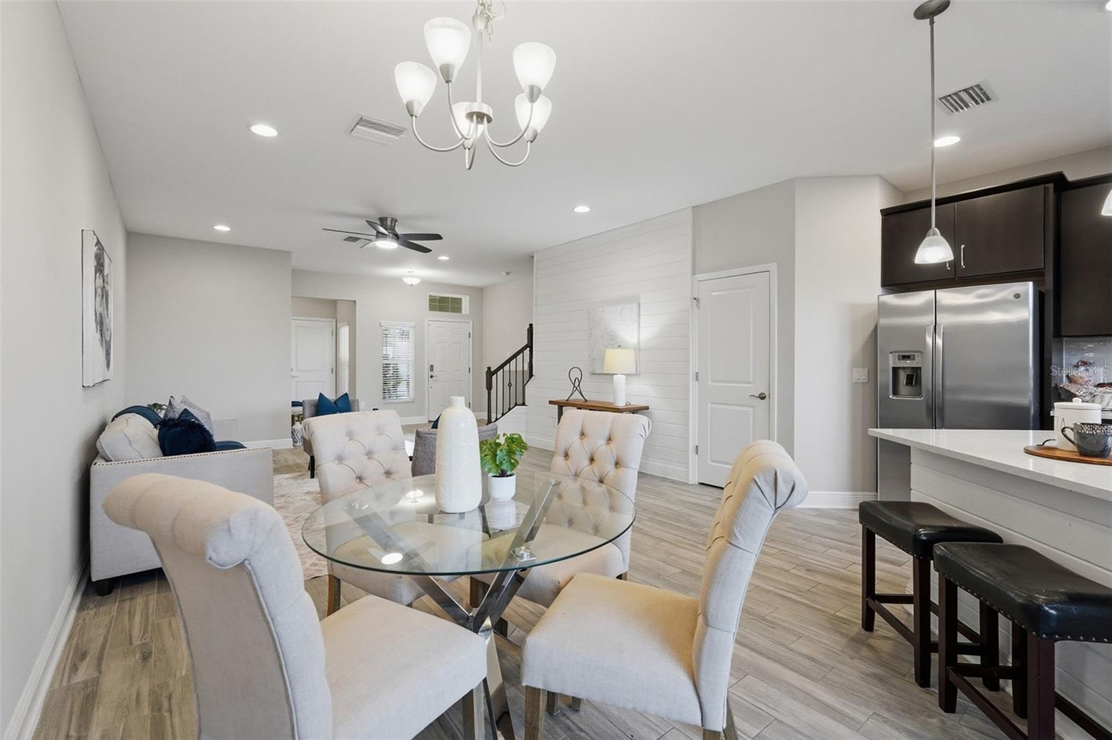 Dining area overlooking kitchen and family room.