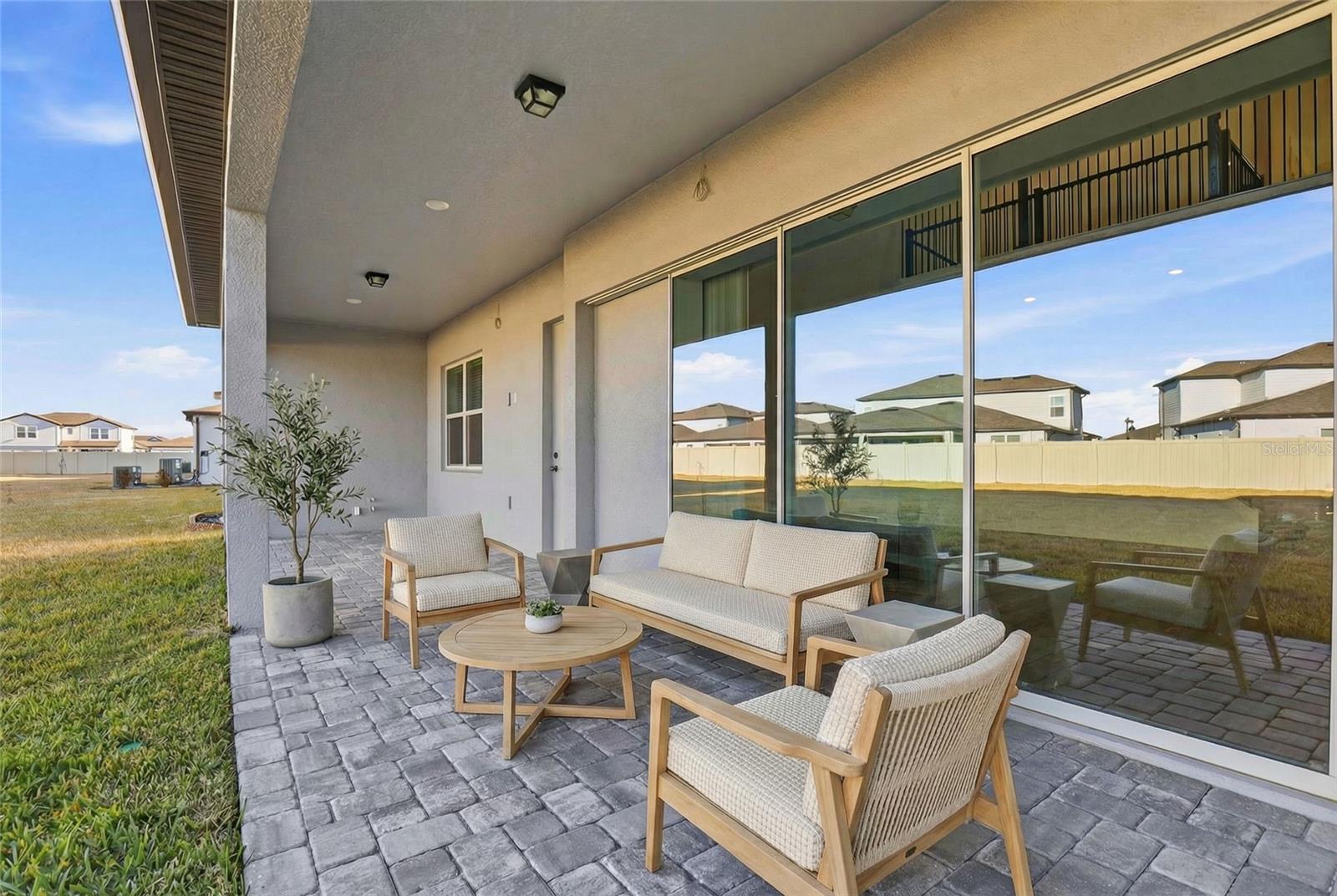 VIRYUALLY STAGED - COVERED LANAI W/ OUTDOOR KITCHEN HOOKUP