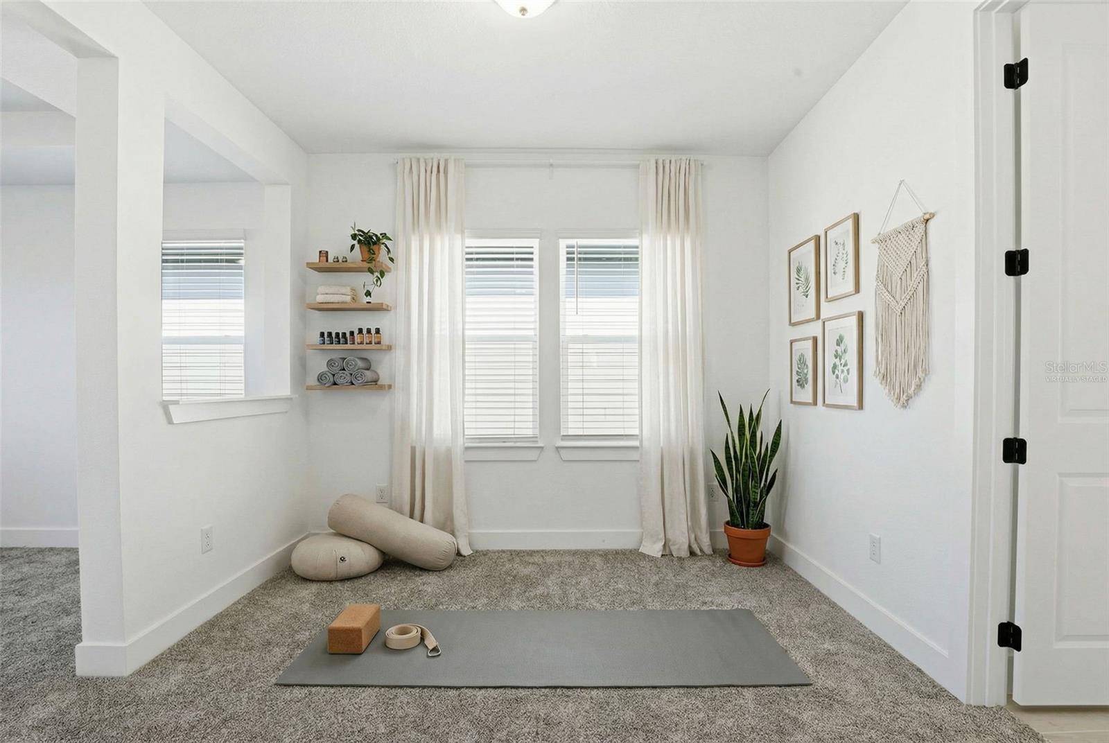 VIRTUALLY STAGED - PRIMARY SUITE W/ SITTING AREA