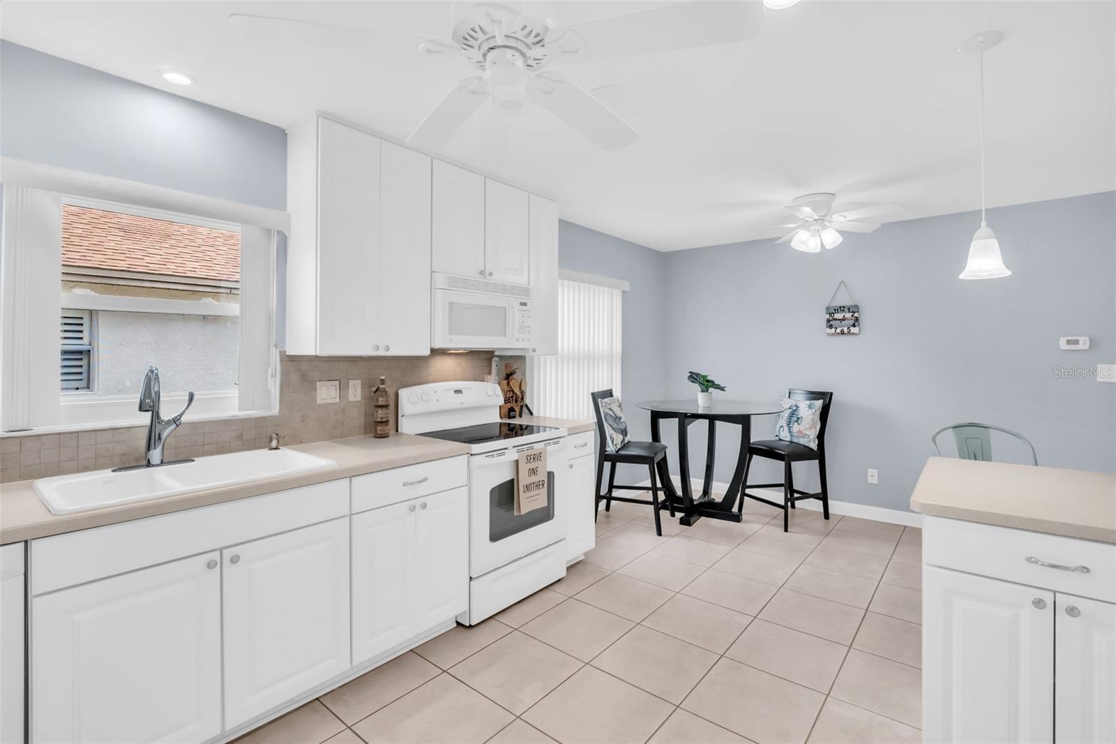 Newer solid wood cabinets with abundant counter space & cabinetry~