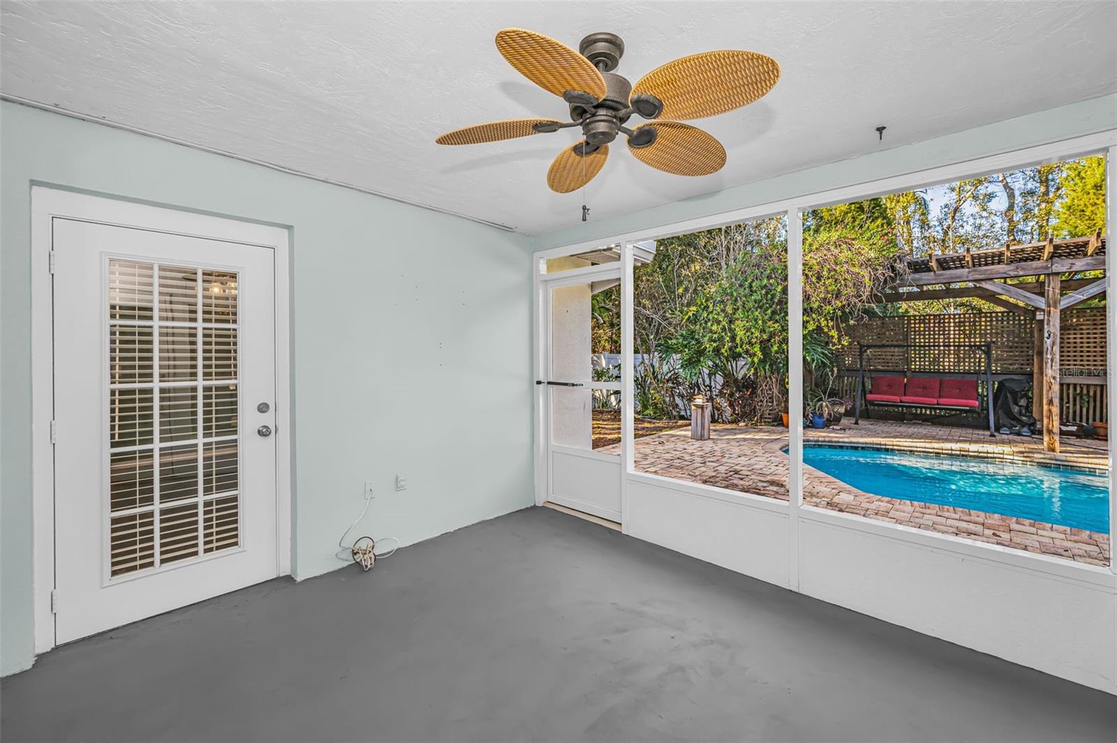 Screened sunroom overlooking the pool