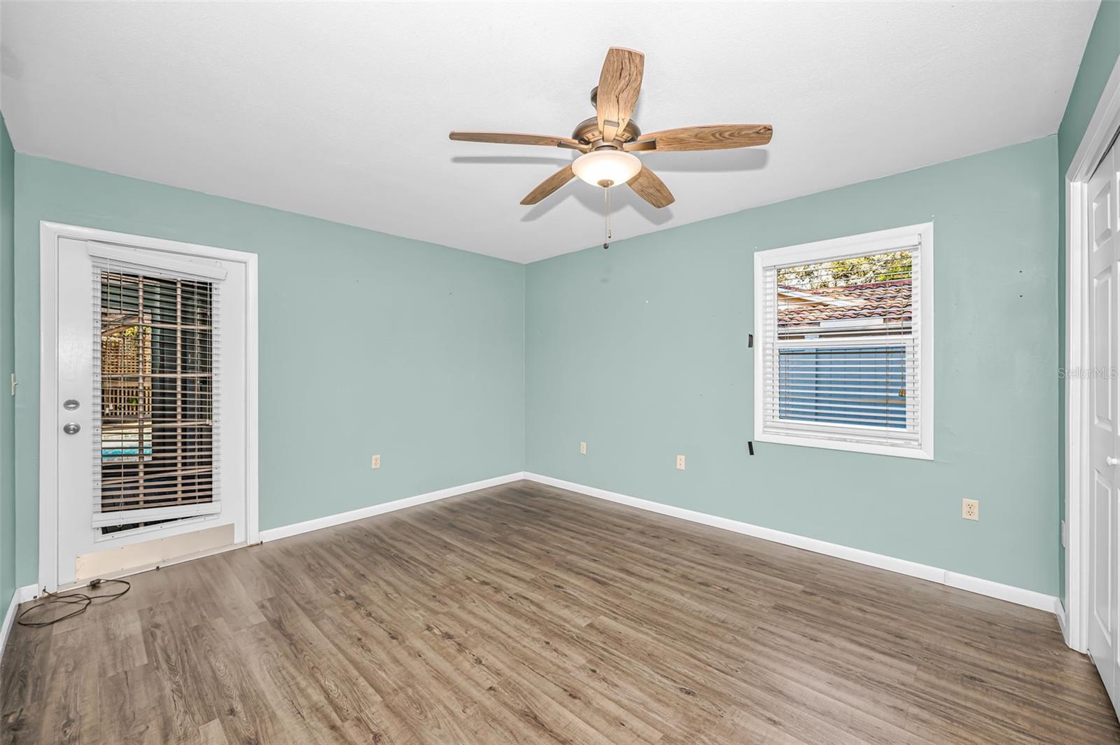 Bedroom 3 with access to the enclosed sunroom
