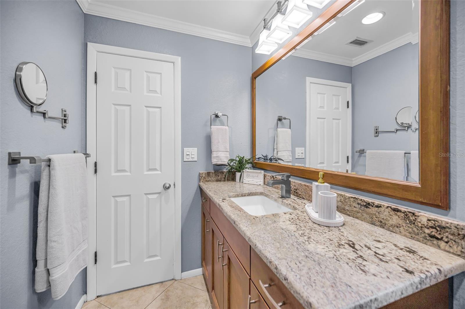 Granite counter and a convenient door to the laundry area.