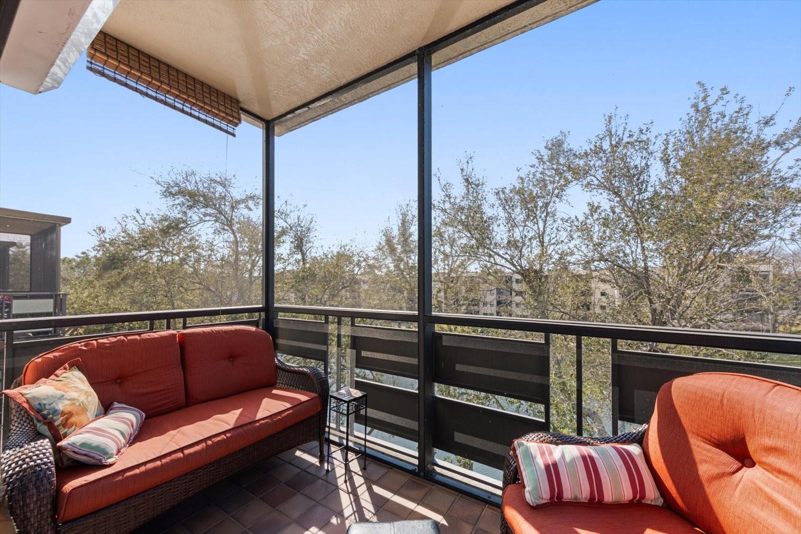 spacious screened porch with pond view