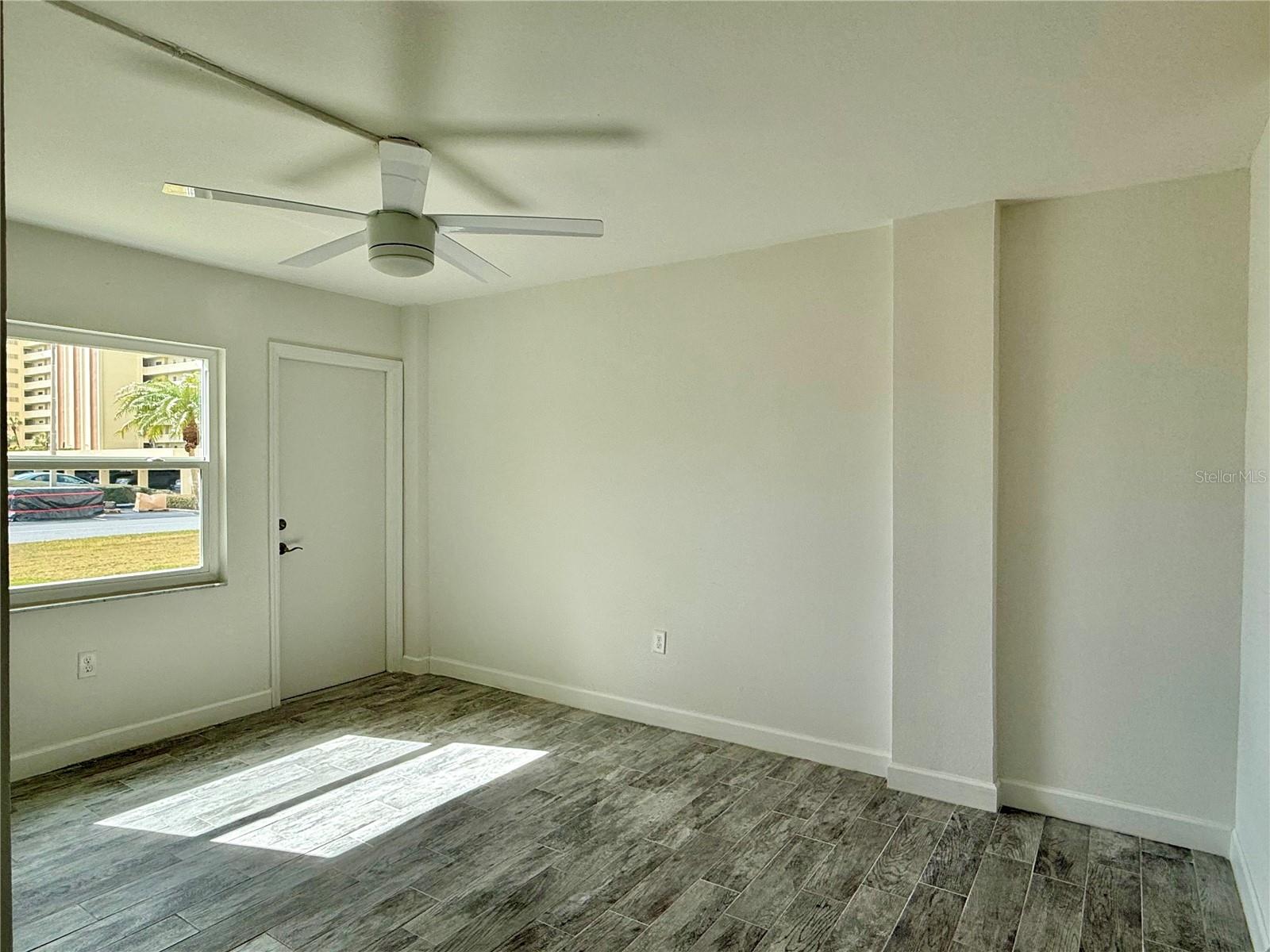 Large 14x11 bedroom with tile flooring.