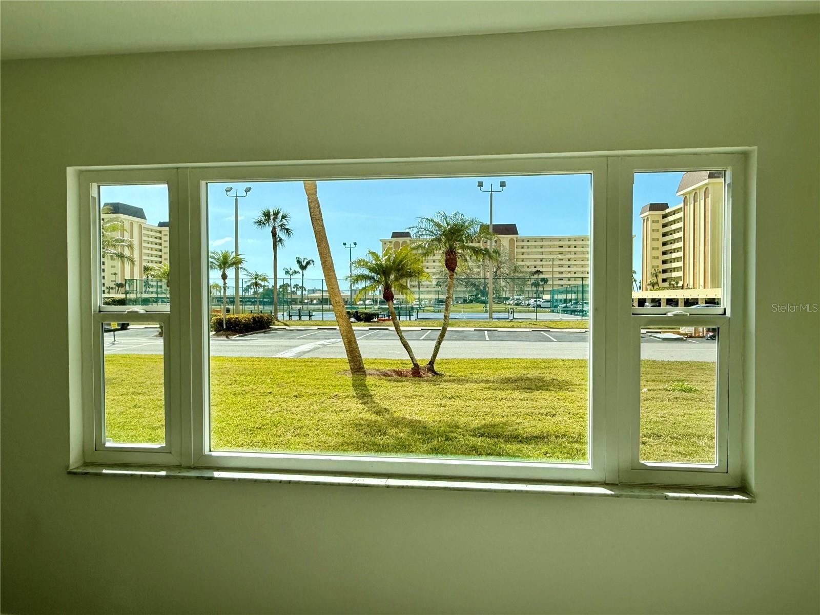 Impact windows with tennis court views.