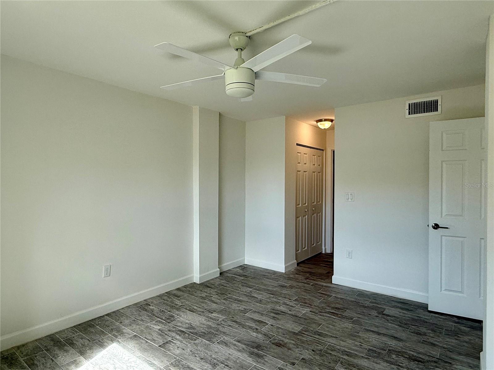 Large 14x11 bedroom with tile flooring.