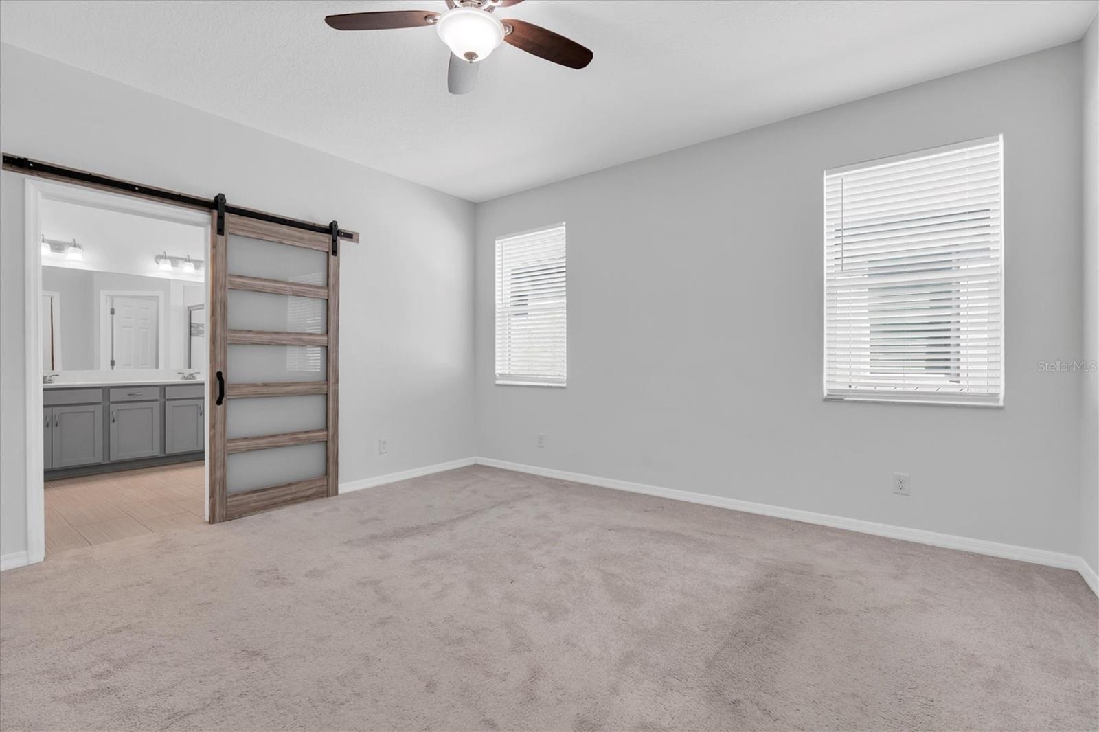 PRIMARY BR WITH BARN DOOR TO ENSUITE