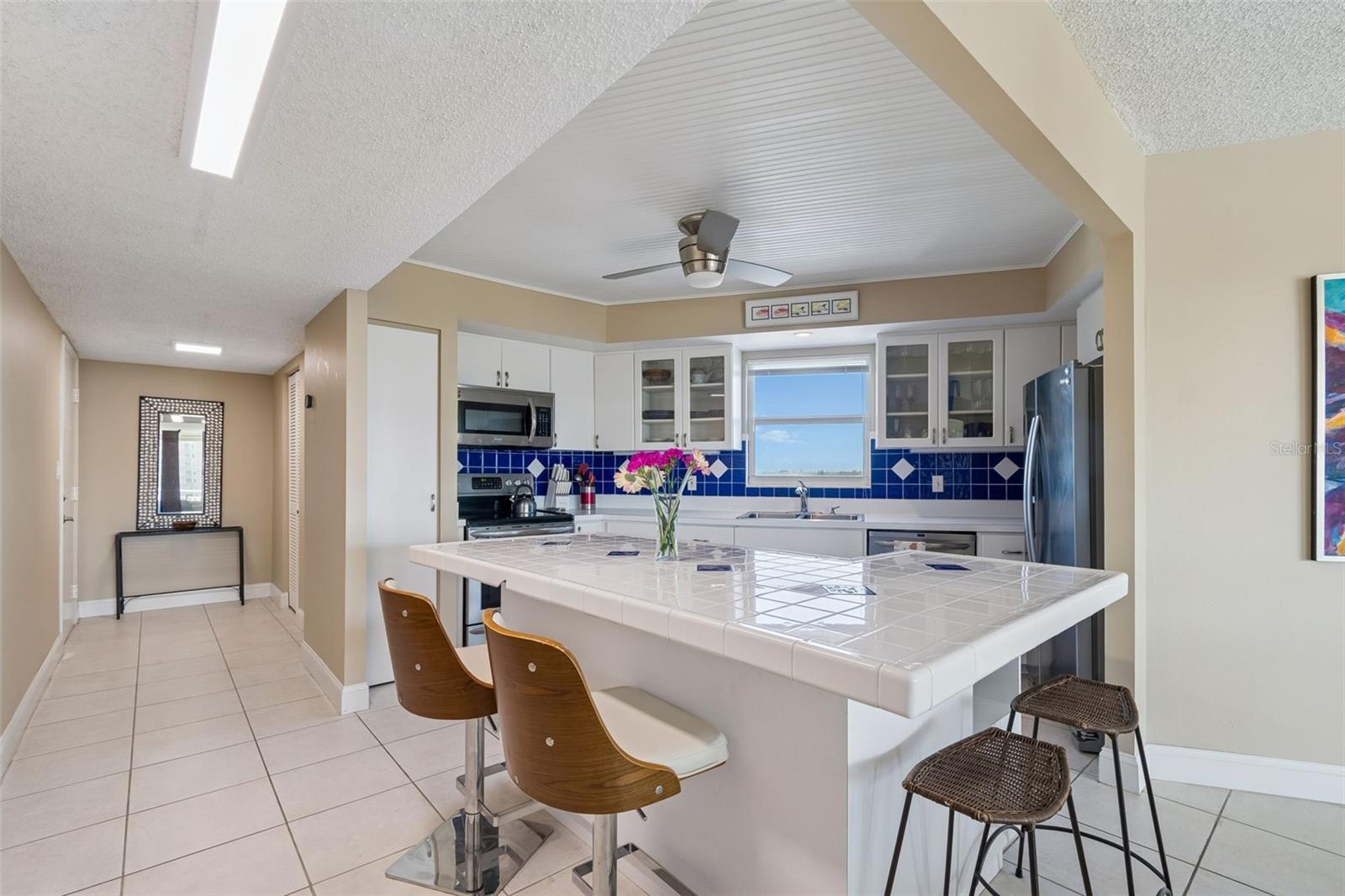 Looking from living room to kitchen and entry