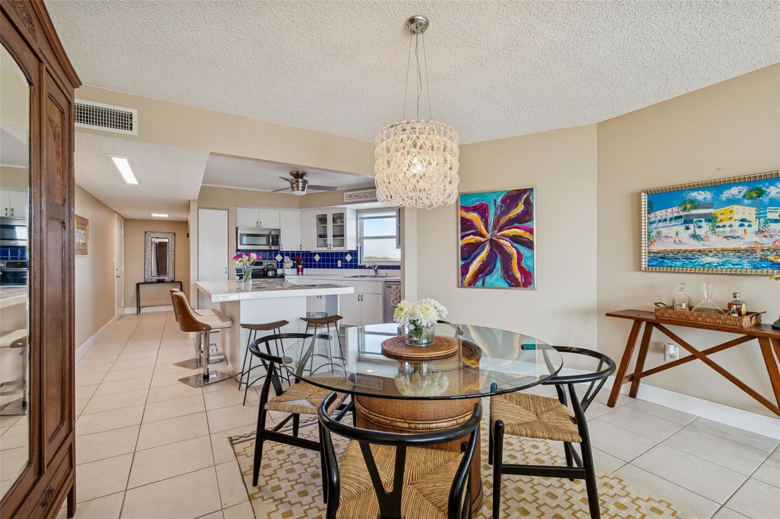 The natural light extends into dining area and kitchen