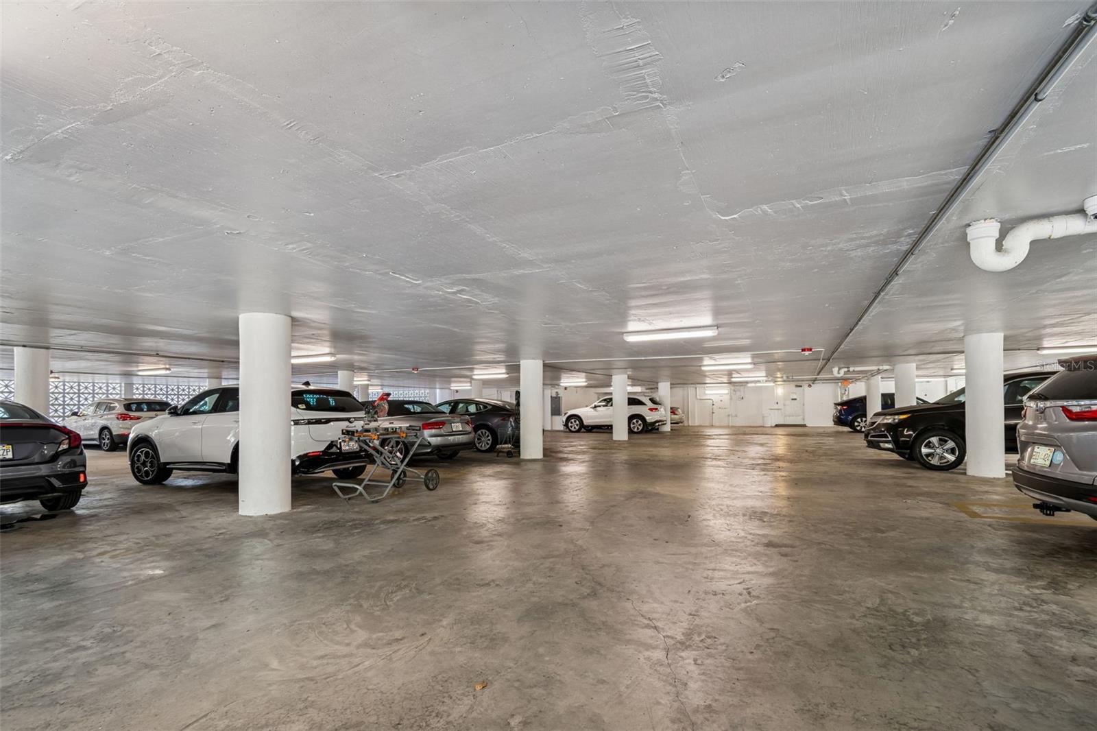 Secure parking garage with reserved space