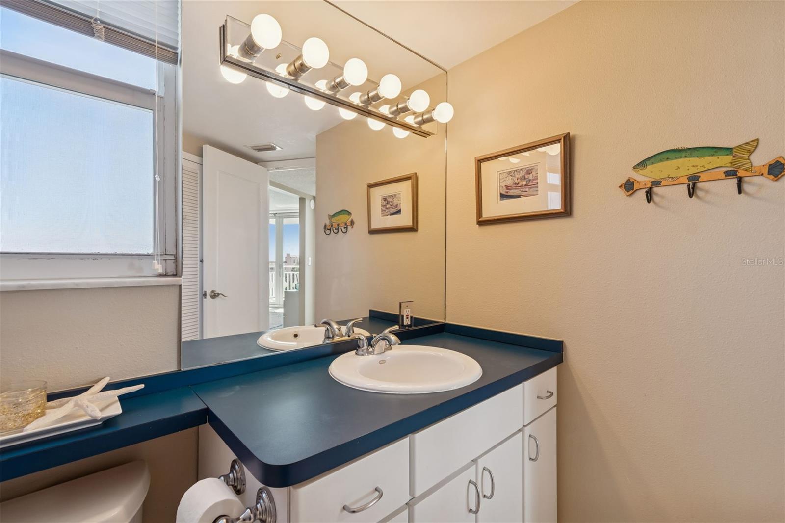 Bathroom with usable space and cabinets
