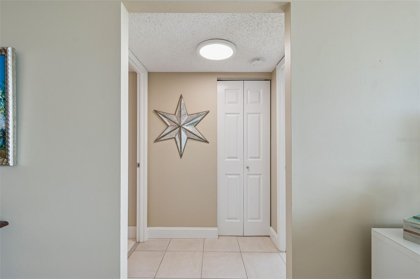 Hallway to bedroom and bathroom