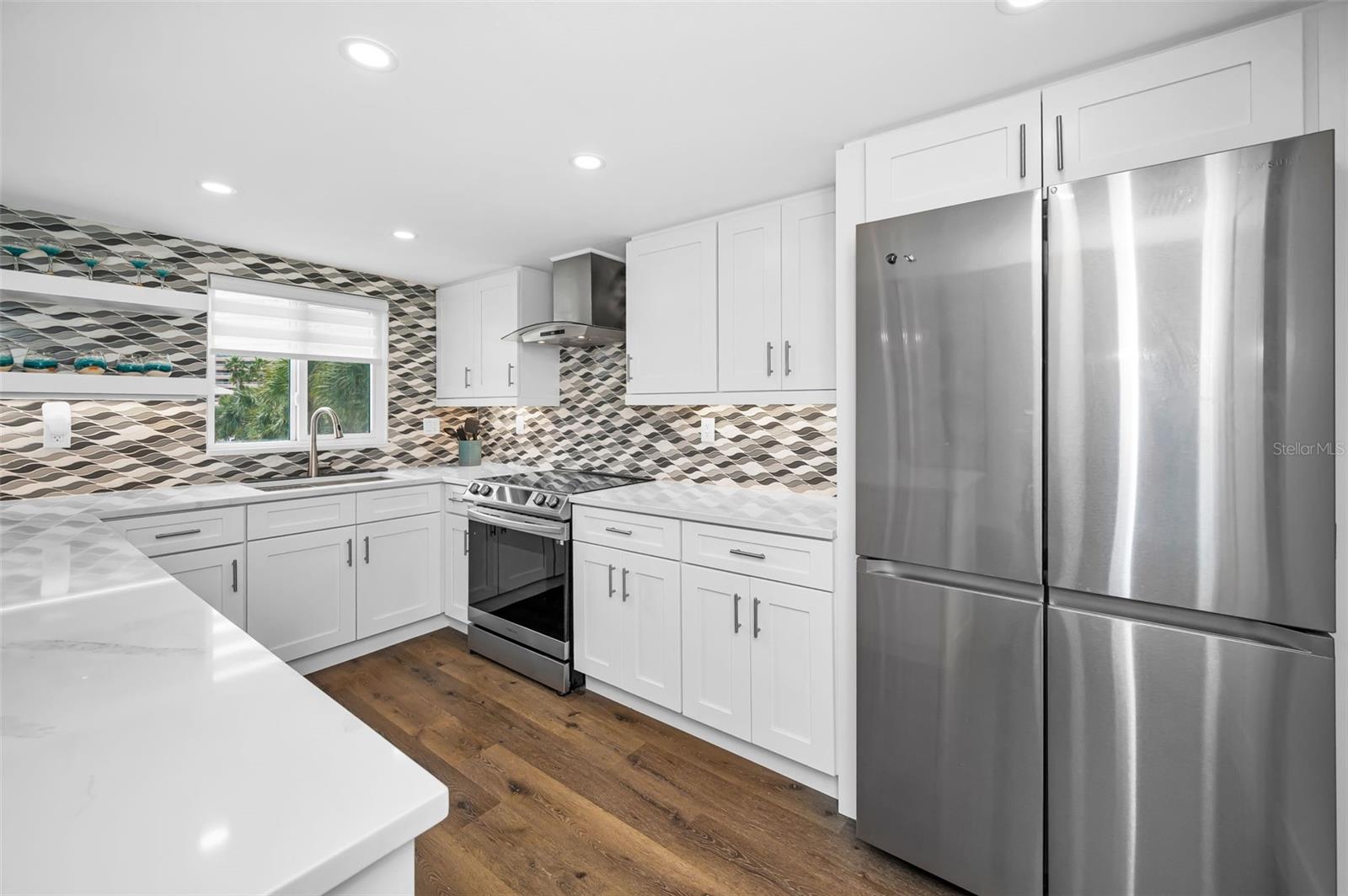 Quartz countertops, Nautical tile backsplash & SS Appliances