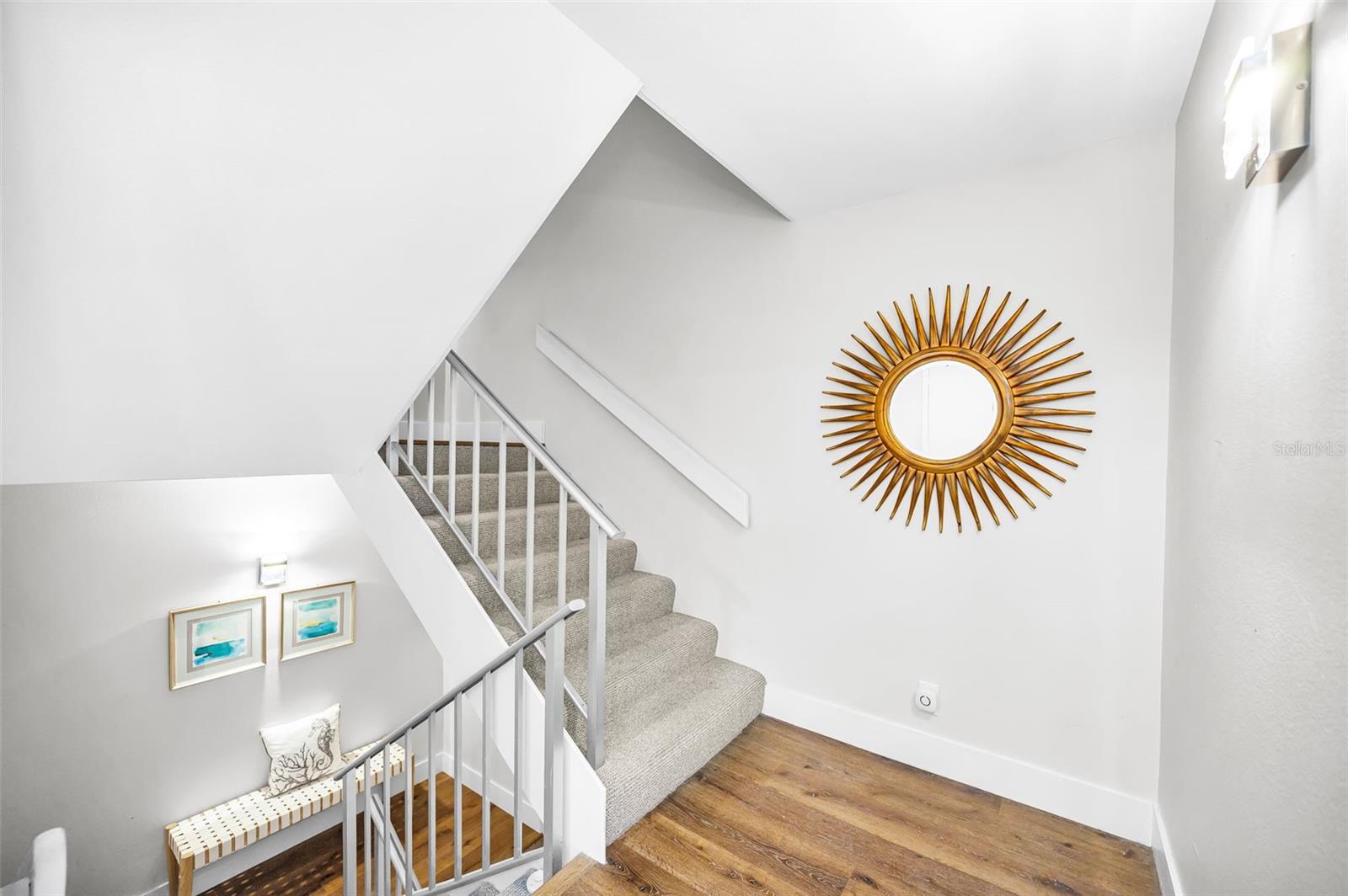 Main level landing leading to the staircase to the Upper Level