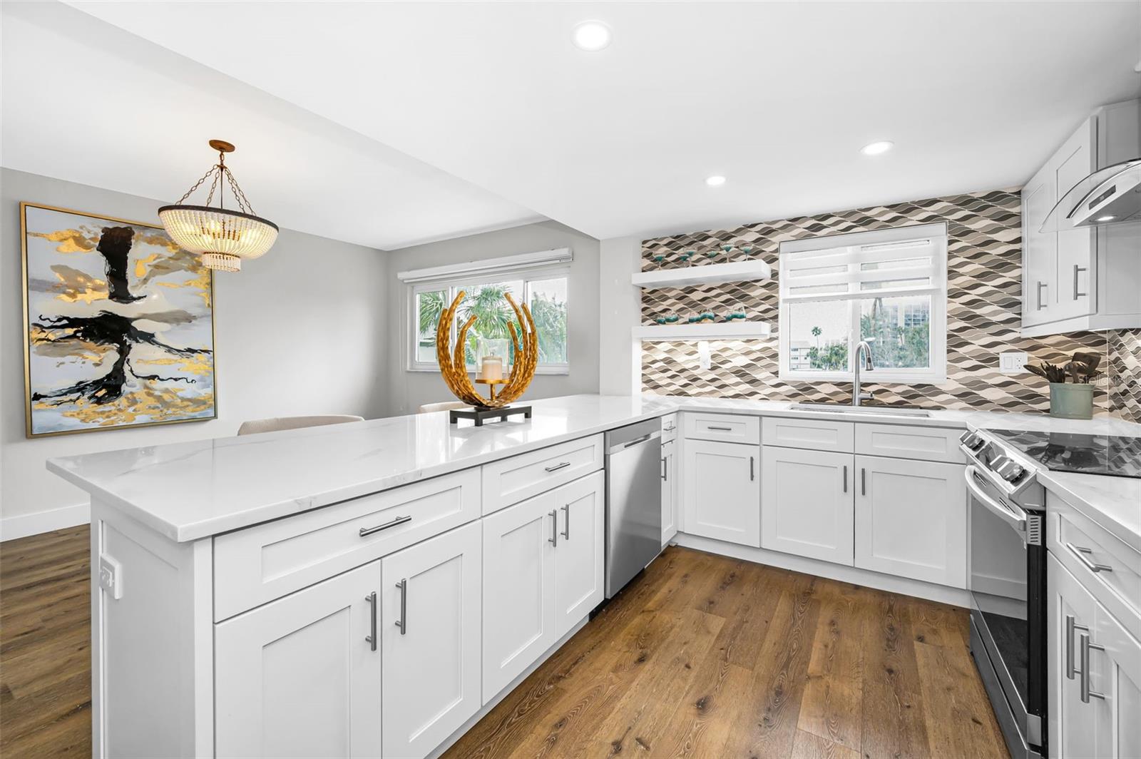 An updated coastal-contemporary kitchen with crisp lines, quartz surfaces, and a soothing palette inspired by the shoreline