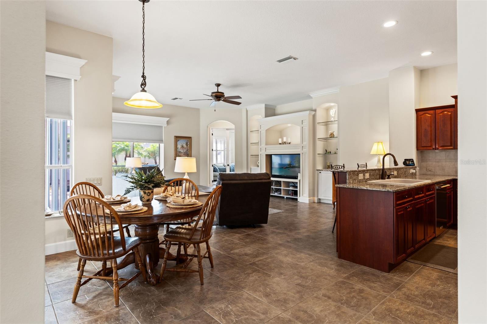 The open dining space is perfectly positioned between the kitchen and living area, offering an ideal setting for everyday meals or casual entertaining.