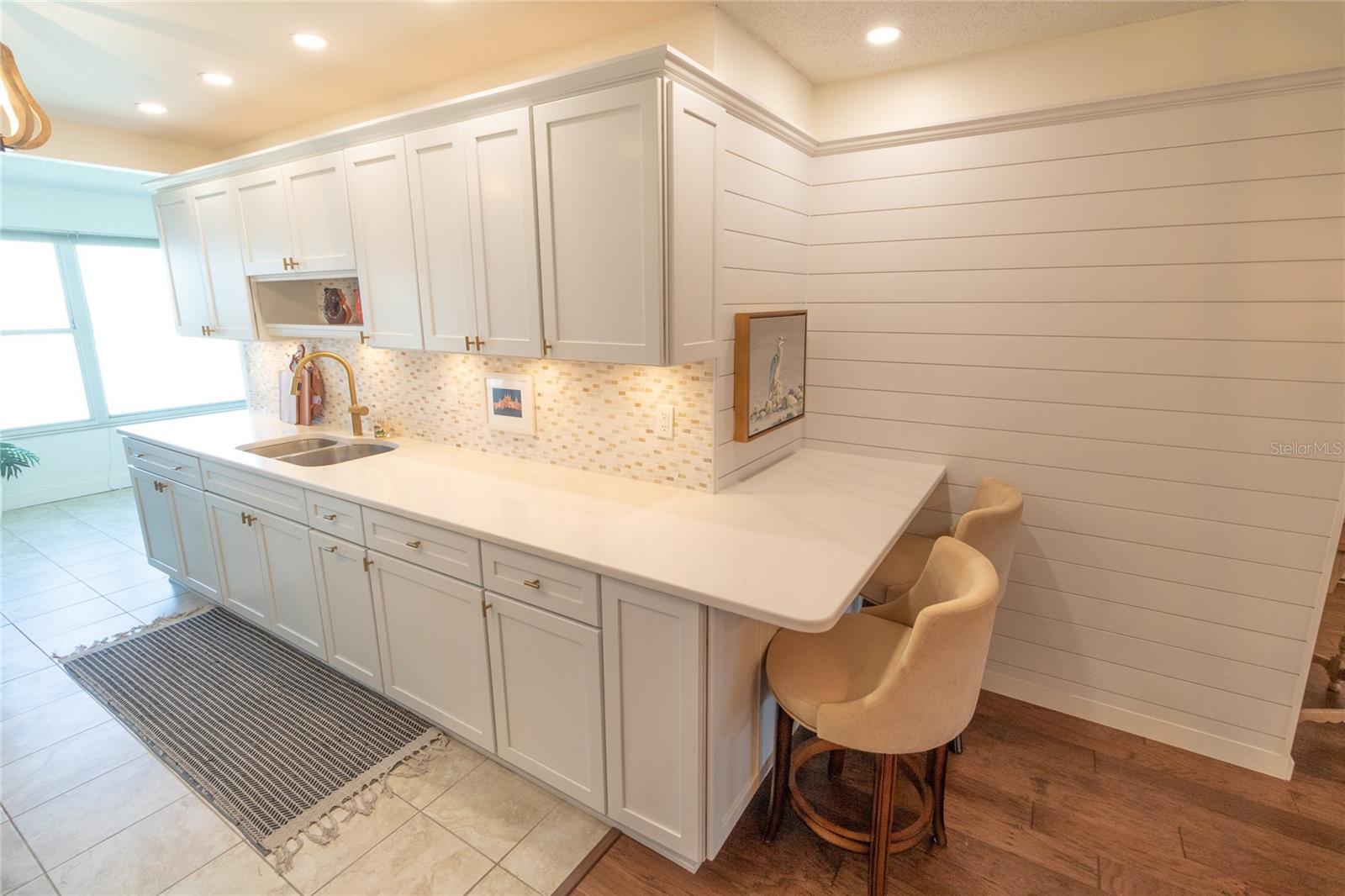 Kitchen Area w/ Breakfast Bar.